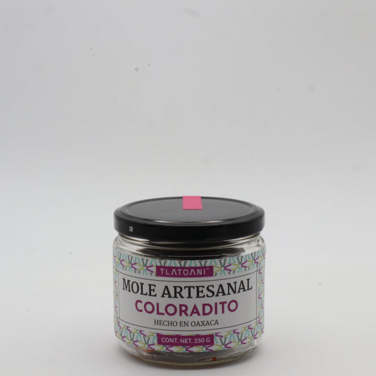 Frasco de mole artesanal coloradito Tlatoani de 250g, hecho en Oaxaca, con tapa negra y etiqueta color magenta sobre fondo blanco.